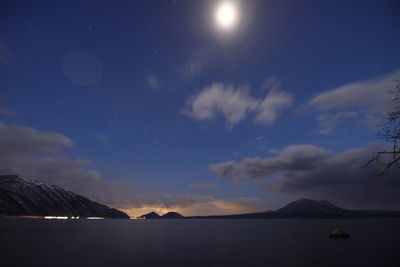 Scenic view of sea against sky at night
