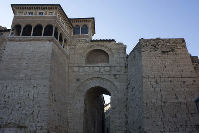 Low angle view of old building against clear sky