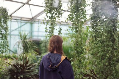 Rear view of woman standing in park