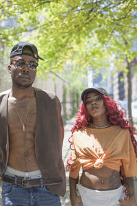 Portrait of young couple standing outdoors