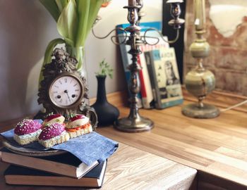 Close-up of clock on table