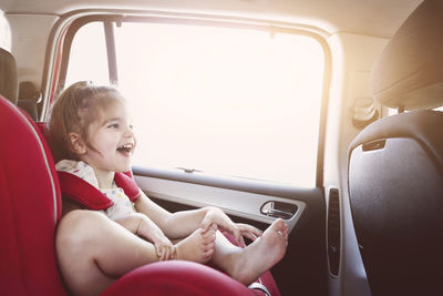 Boy sitting in car