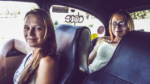 Portrait of woman sitting in car