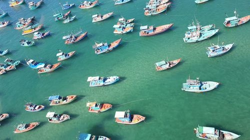 High angle view of sailboats moored in sea