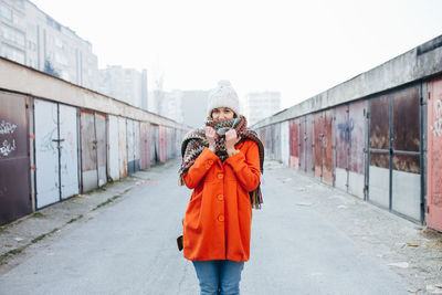 Young woman standing outside in cold weather