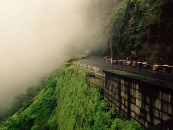 Scenic view of mountains in forest during foggy weather