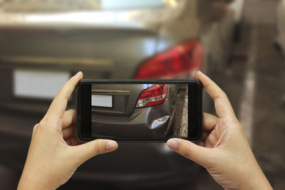 Close-up of hand holding smart phone