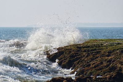 Waves splashing on rocks