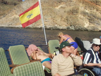 Group of people sitting in the water