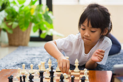 Boy playing on table