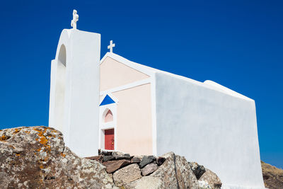 Low angle view of building against clear blue sky