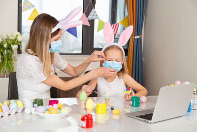 Mother and son on table