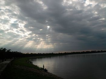 Scenic view of sea against cloudy sky