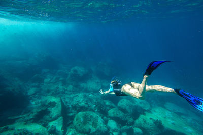 Young woman swimming in sea