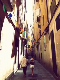 Alley amidst buildings in city