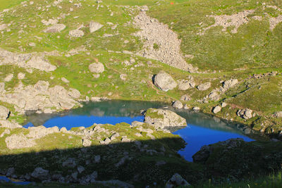 Scenic view of lake by rocks