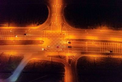 Light trails on road against sky at night