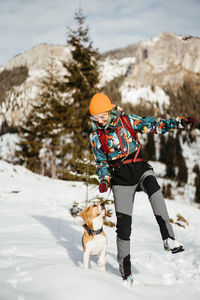 Man skiing on snow covered field