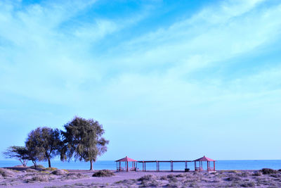 Scenic view of beach against blue sky