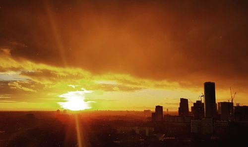 Cityscape against sky during sunset