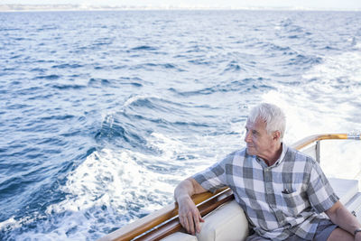 Senior man on a boat trip