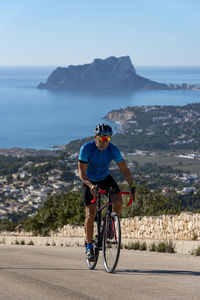 Man riding bicycle on mountain