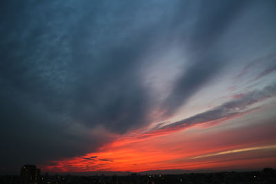 Dramatic sky over city during sunset