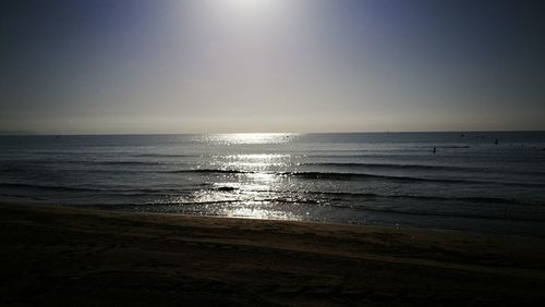 Scenic view of beach against sky during sunset