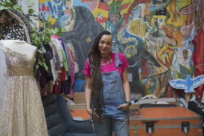 Portrait of smiling young woman standing outdoors