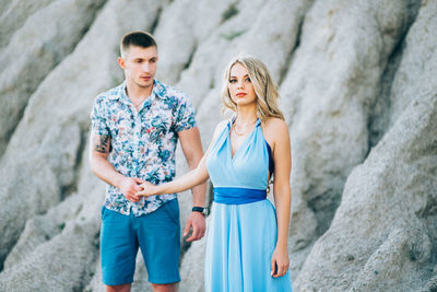 Young couple standing on rock