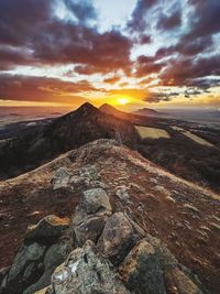 Scenic view of mountains against sky during sunset