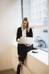 Businesswoman using laptop