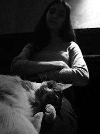 Midsection of woman with cat