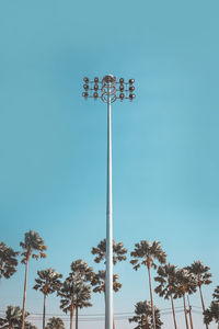 Low angle view of street light against blue sky