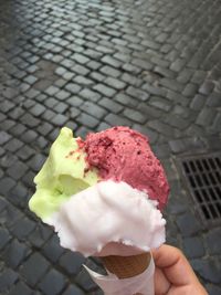 Cropped image of person holding ice cream