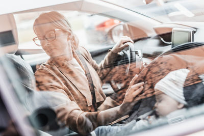 Portrait of man sitting in car