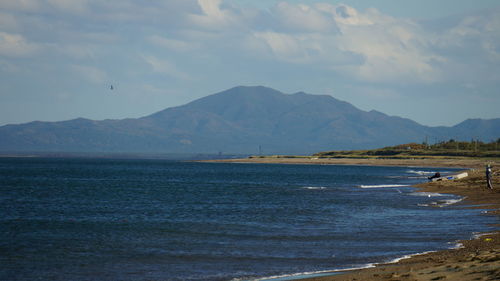 Scenic view of sea against cloudy sky