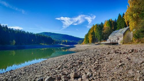 Idyllic view of calm lake against sky during autumn