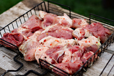 High angle view of meat on barbecue grill