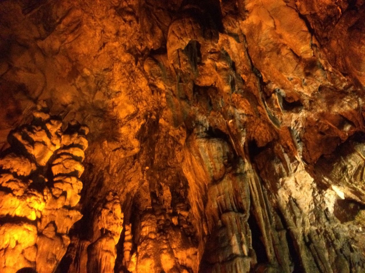 cave, stalactite, textured, rock formation, geology, rock - object, physical geography, nature, no people, rough, low angle view, close-up, tree trunk, illuminated, beauty in nature, tree, rock face, outdoors, day