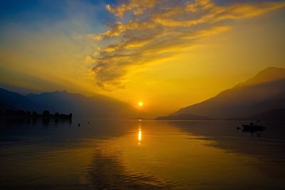 Scenic view of lake against sky during sunset