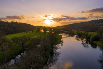 Scenic view of landscape against sky during sunset