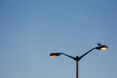 Low angle view of street light against clear sky