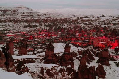 Aerial view of landscape against sky during winter