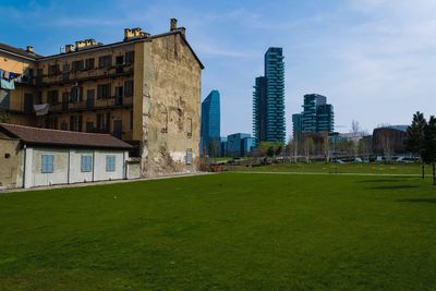 Buildings in city against sky