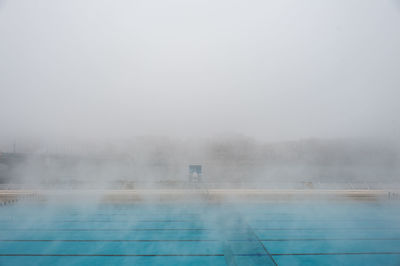 Wet foggy weather against sky during rainy season