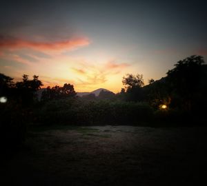 Scenic view of silhouette landscape against sky at sunset