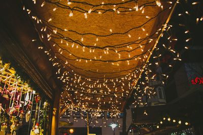 Low angle view of illuminated lanterns hanging on ceiling