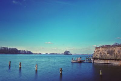 Scenic view of sea against blue sky