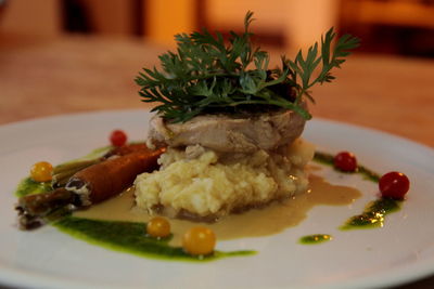 Close-up of burger in plate on table